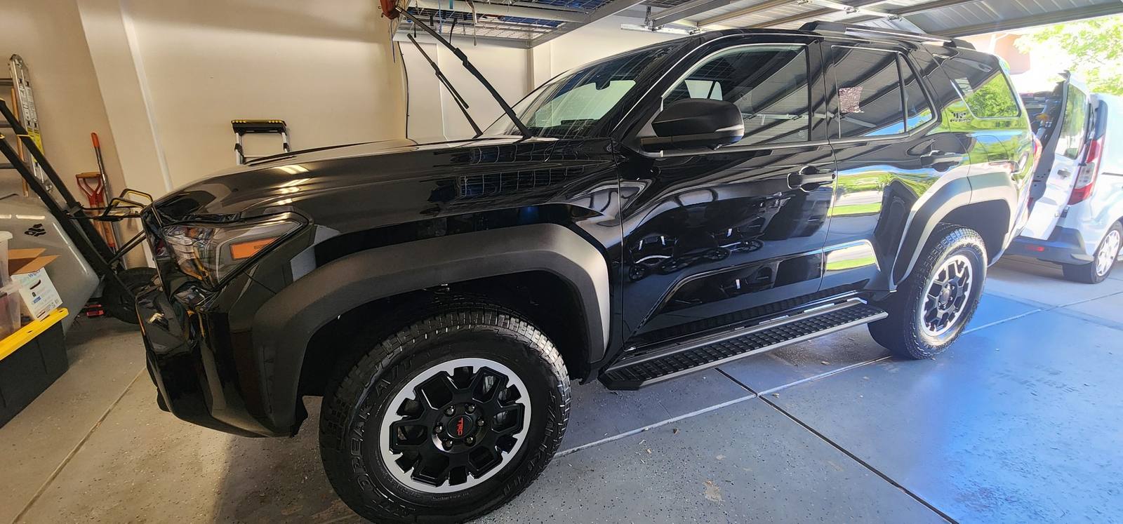 Glossy black Toyota 4Runner TRD Pro freshly detailed in a residential garage